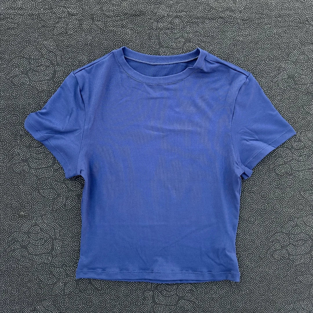 Solid color women's soft breathable yoga short-sleeved comprehensive training tight T-shirt with exposed belly button
