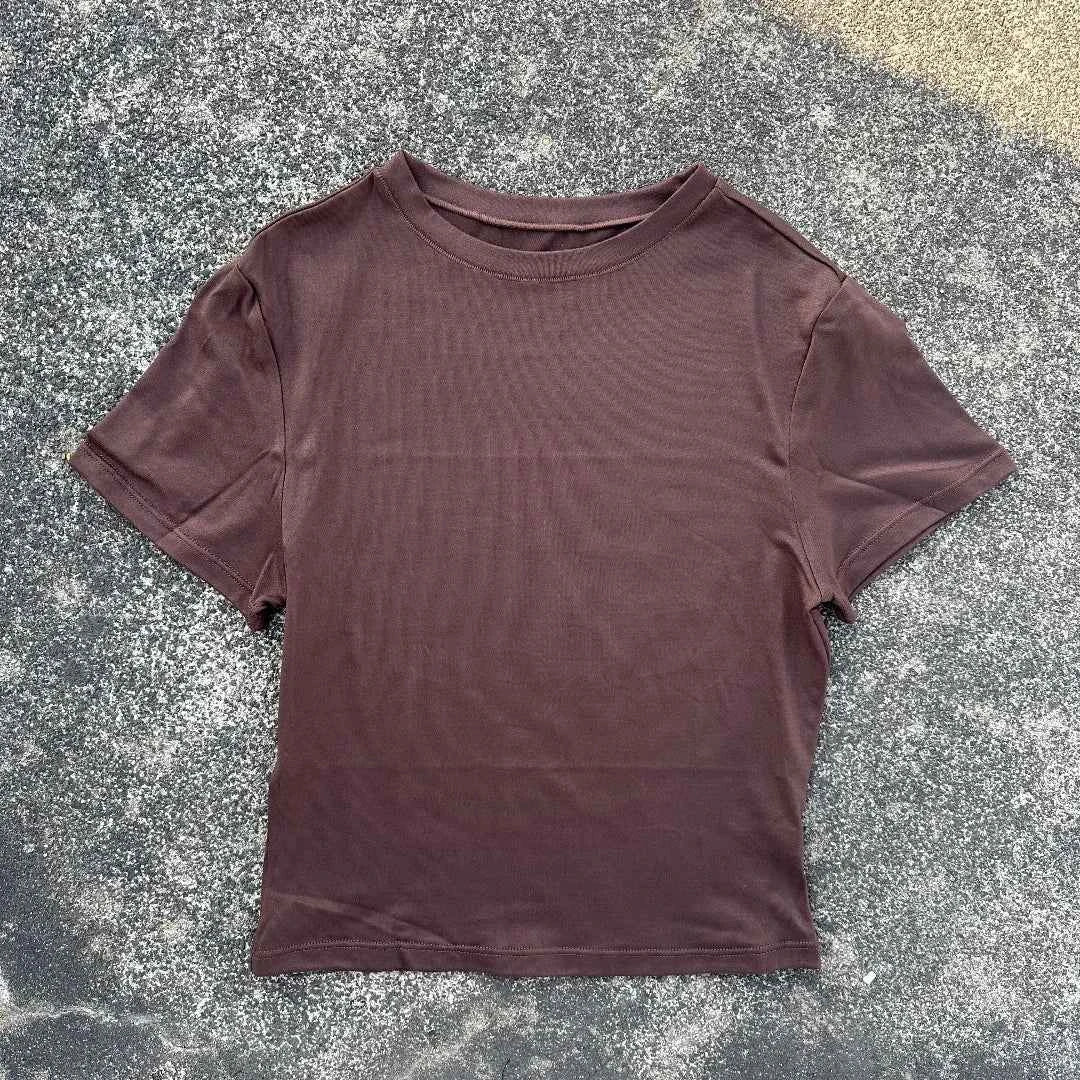 Solid color women's soft breathable yoga short-sleeved comprehensive training tight T-shirt with exposed belly button